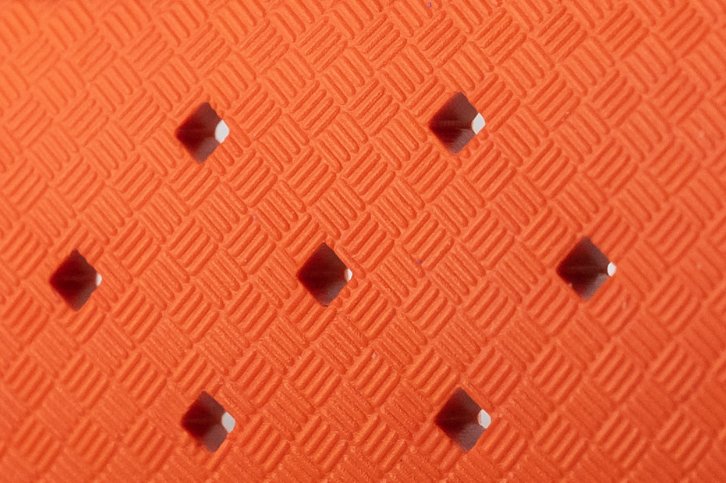 An orange Tropic Vulcanized Rubber Strap's diamond pattern close up.