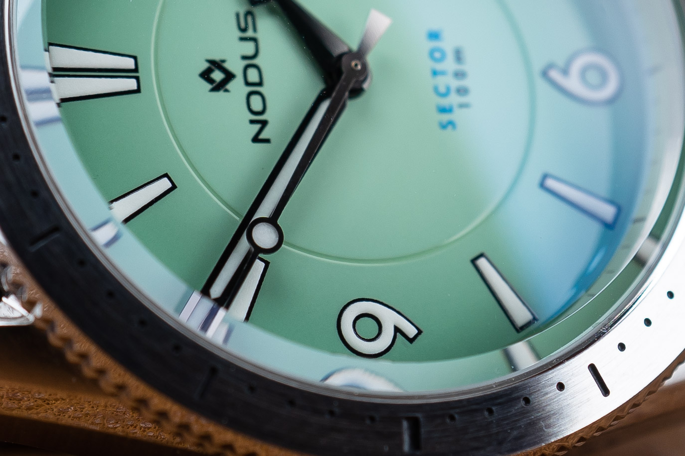 Macro of the green dial of the Nodus Sector 100 dive watch.